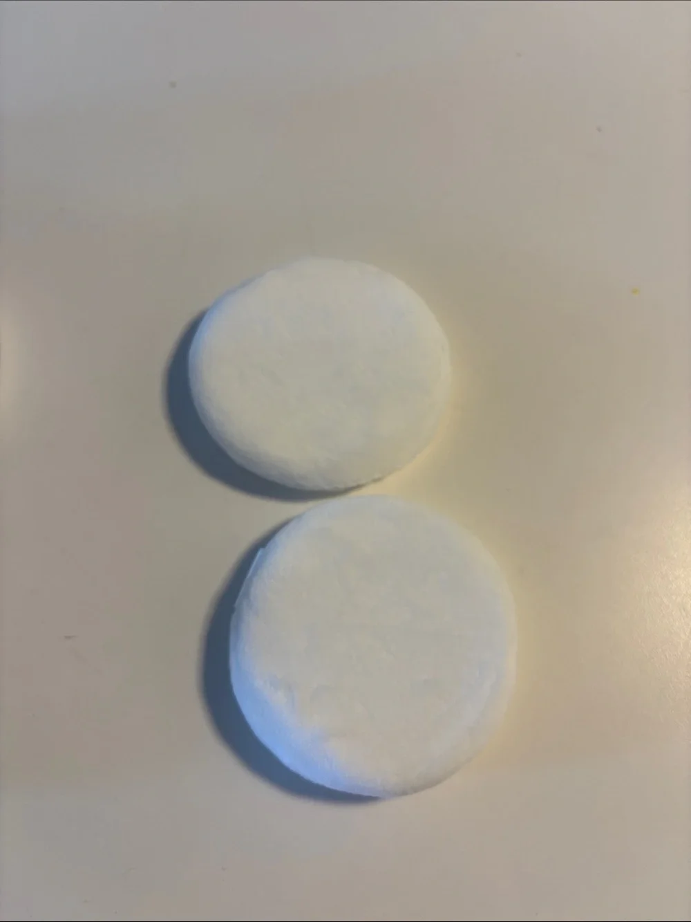 Chanel powder jars and puffs